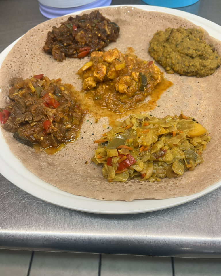 Ethiopian anjero platter with meat and vegetable stews